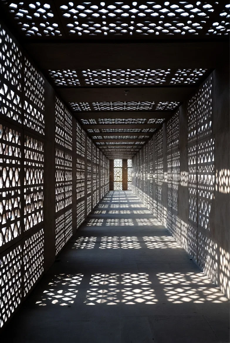 Patterned architectural screens filtering natural daylight